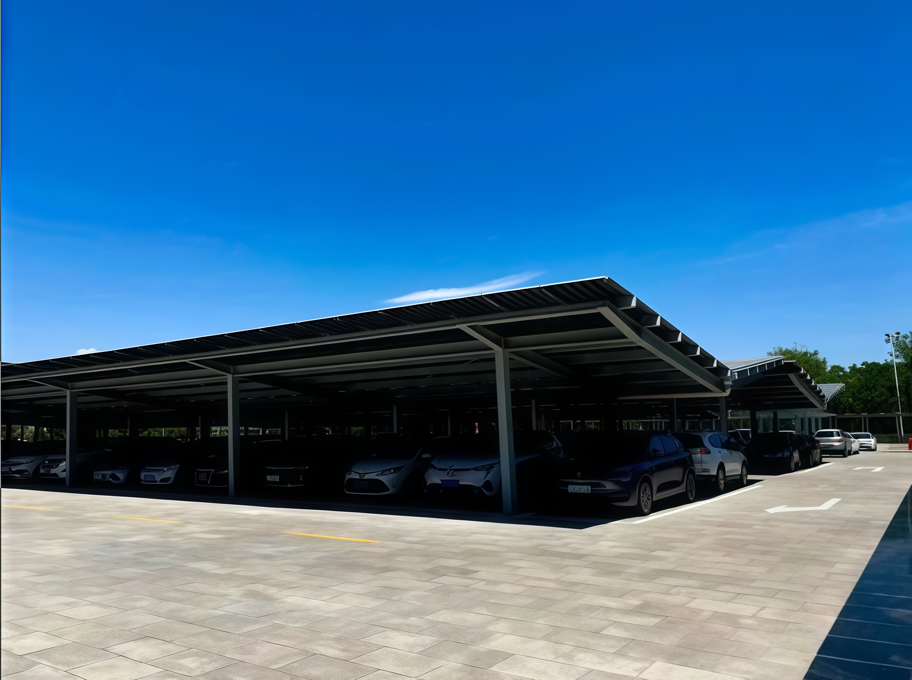 Black Solar Carport Shade, Power, and Sleek Design.png