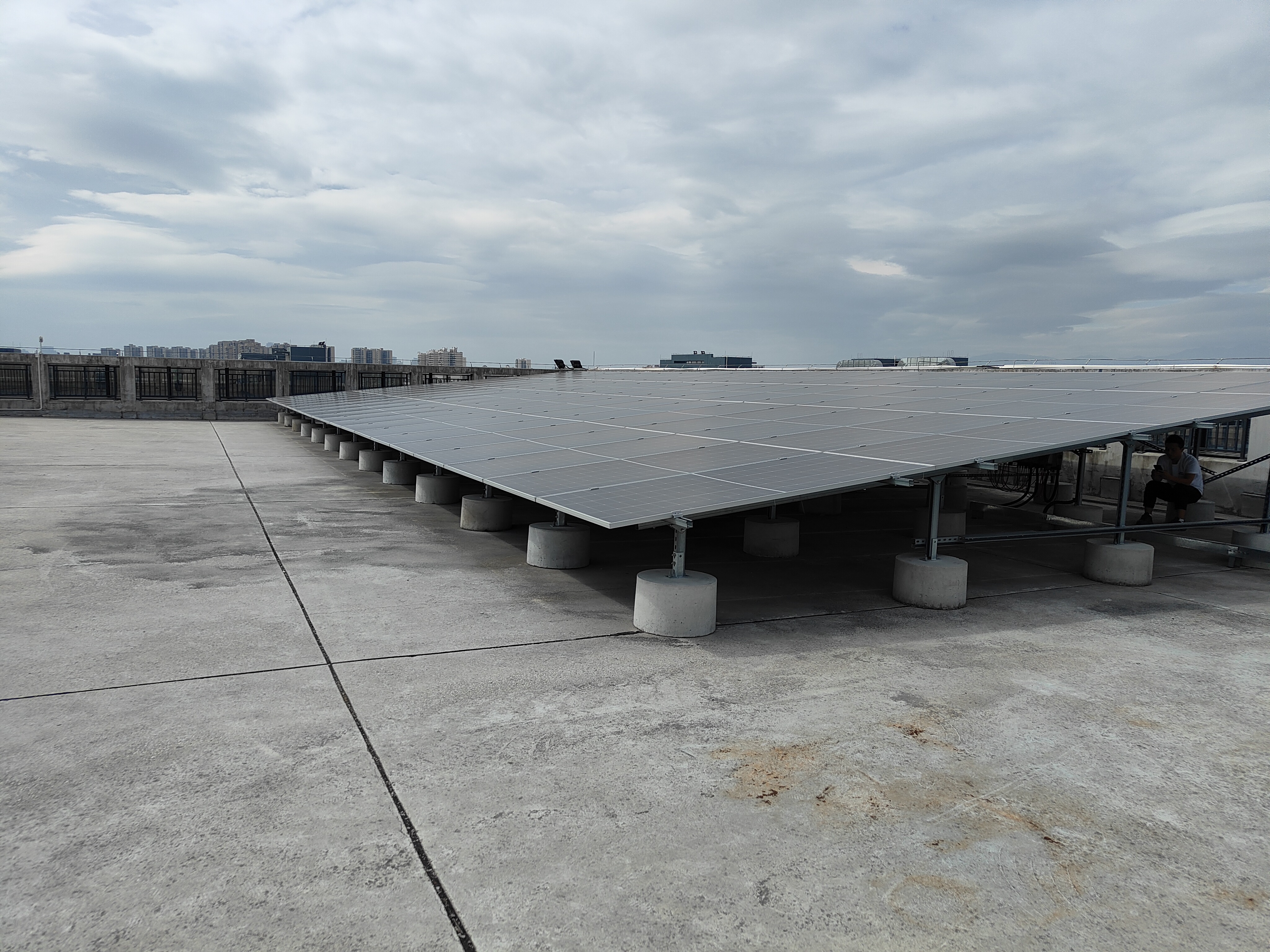 Wind Resistance of Ballasted Concrete Blocks in Rooftop Solar PV
